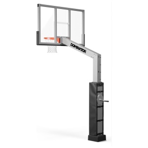 A basketball hoop labeled "dominator" with an adjustable height mechanism, mounted on a sturdy pole with a weight block at the base.