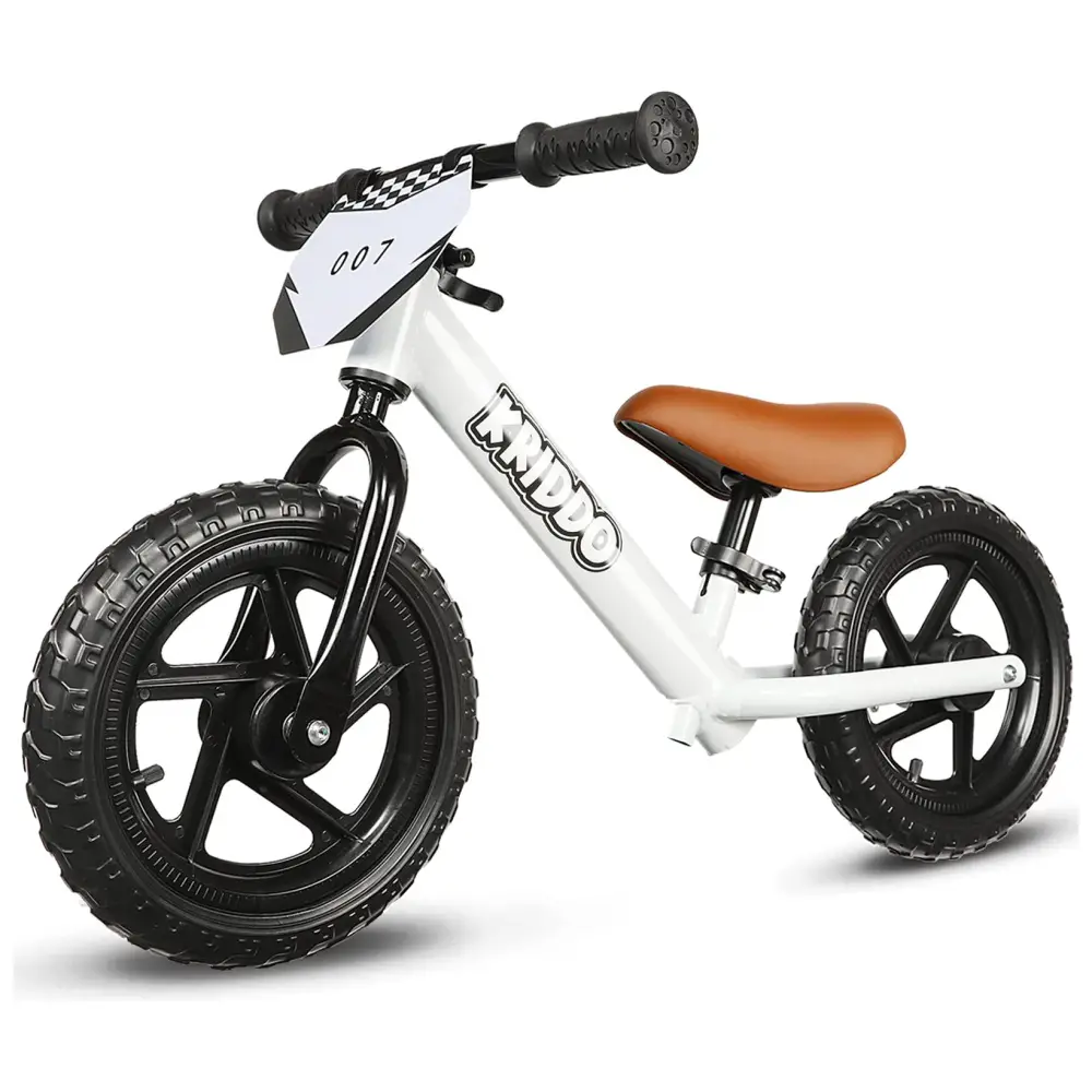 White toddler balance bike with black wheels and brown seat.