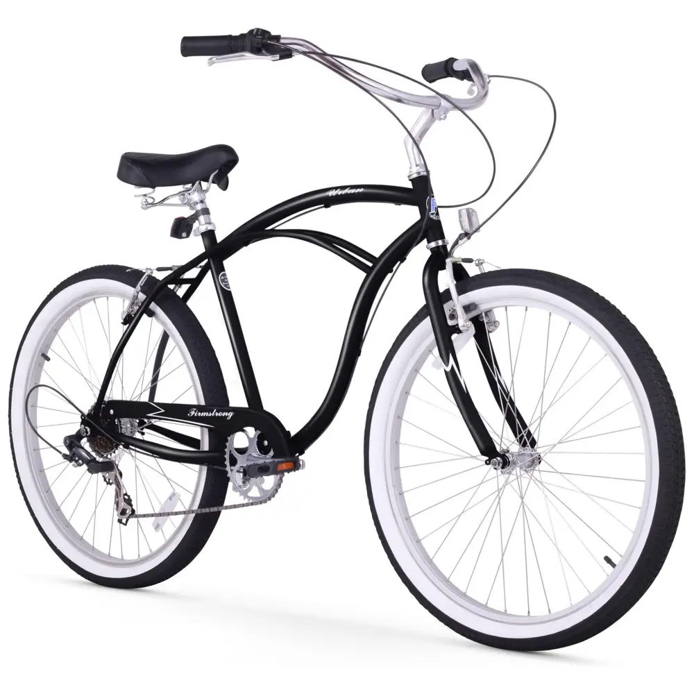 Black cruiser bicycle with white-wall tires against a white background.
