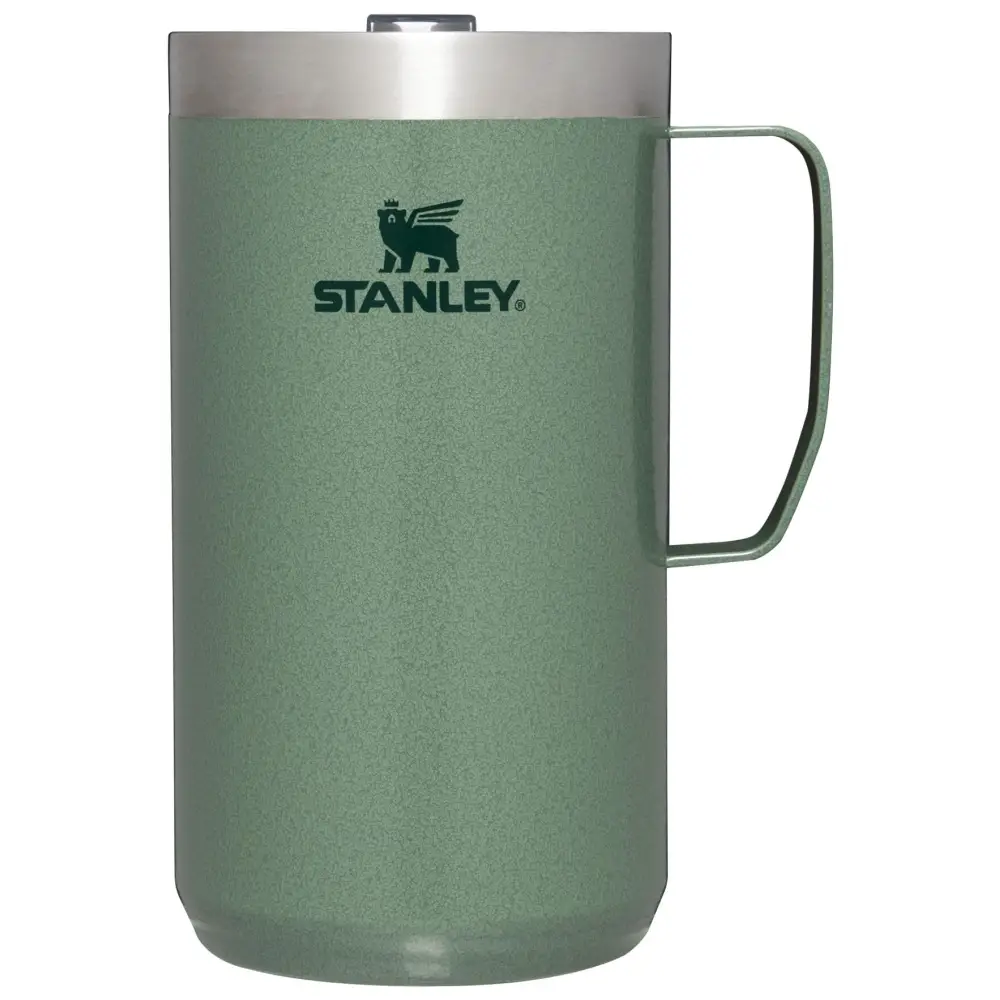 Green stanley insulated mug on a white background.
