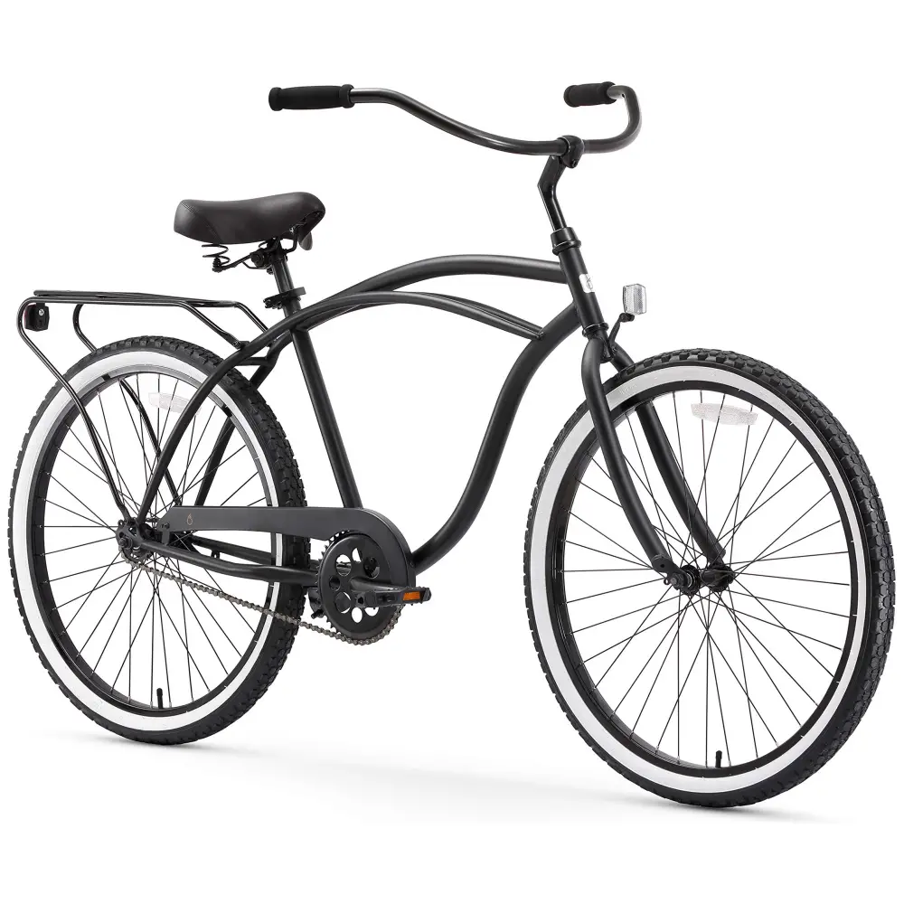A black cruiser bicycle isolated on a white background.