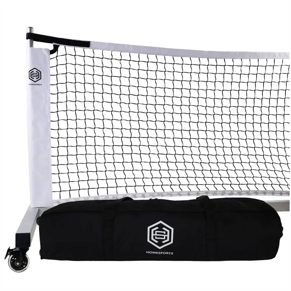 Portable soccer goal with white net and black Dominator Standards Aluminum Portable Pickleball Complete System frame, displayed beside its black carrying bag, set against a white background.