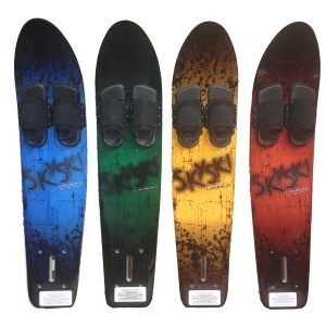 Four water skis with foot bindings, arranged in a row. The skis are colored blue, green, yellow, and red from left to right. All skis have "Sky Ski" branding and similar designs. Two of the skis feature the Sky Ski Launch Sit-Down Hydrofoil technology for an enhanced sit-down experience on the water.